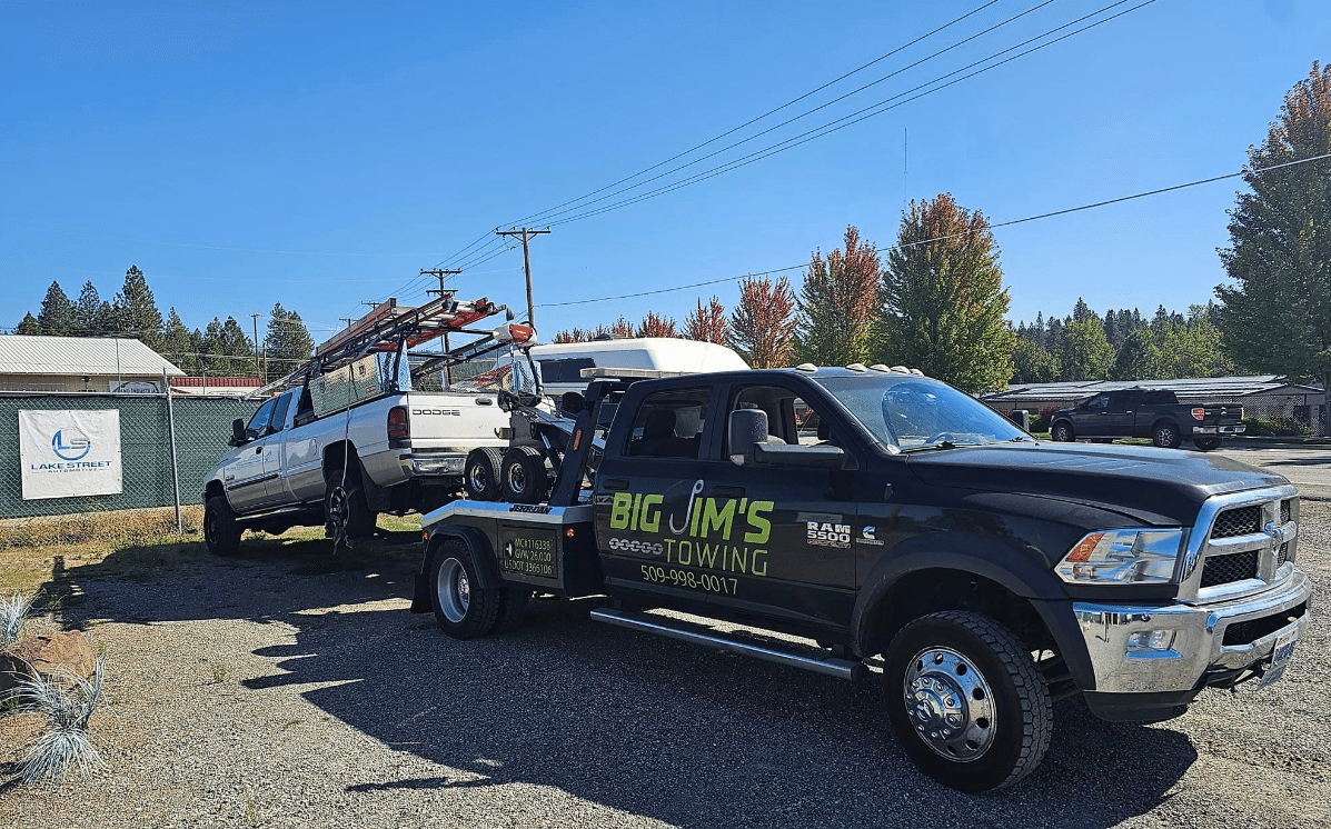 Big Jim's Towing Spokane Wrecker Truck pulling Dodge Ram