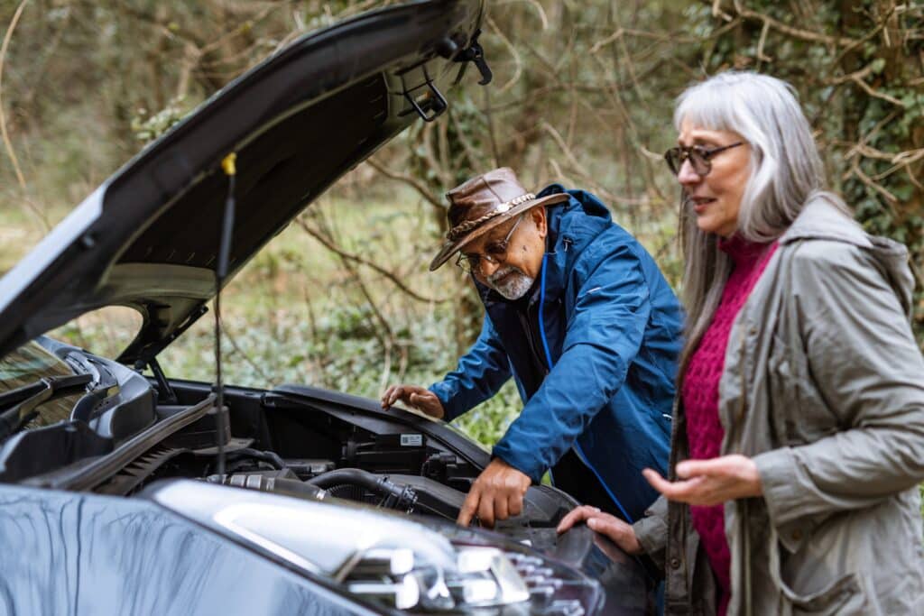 older couple deciding if they need towing or roadside assistance